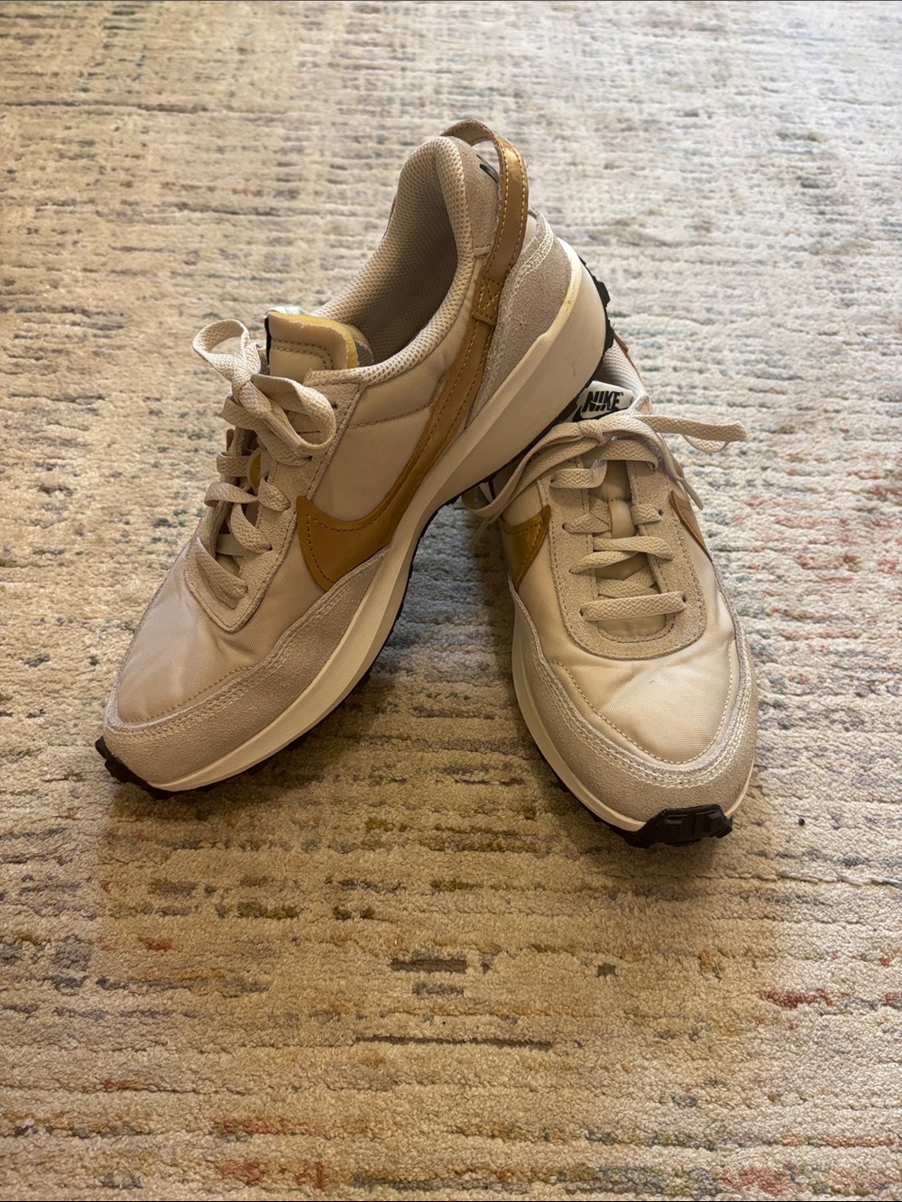 Nike Women's Beige Sneakers with Gold Swoosh Accent